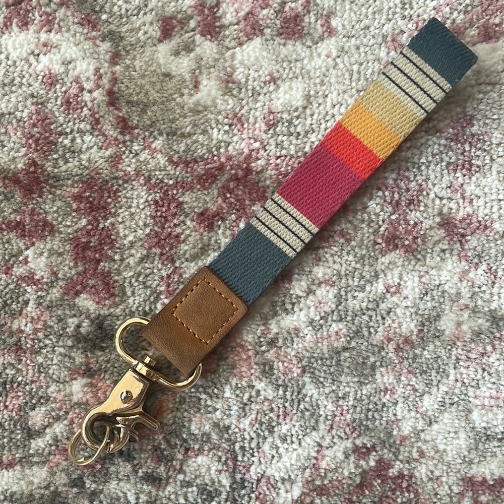 Scheels gold and rainbow lanyard with leather detailing